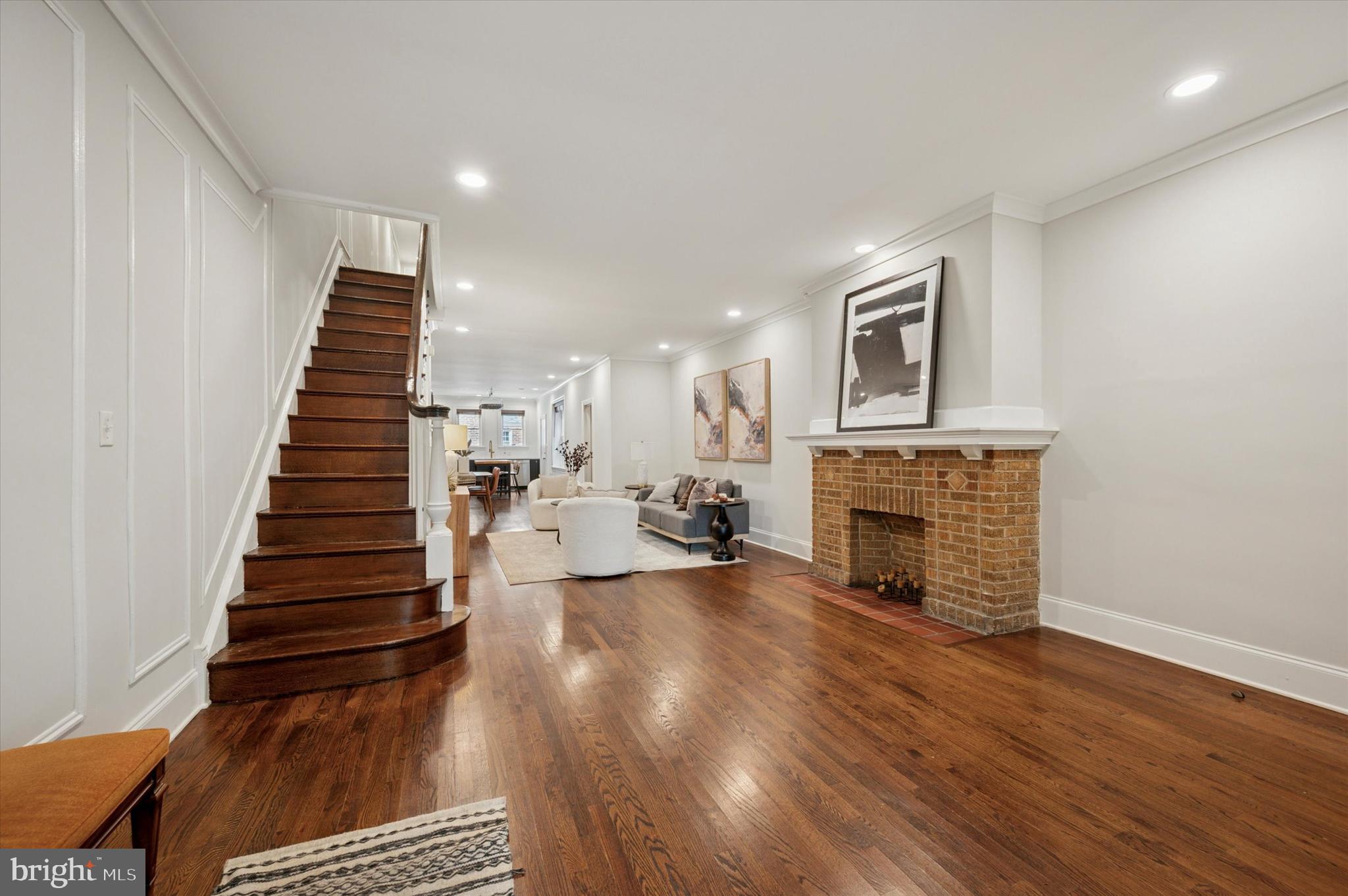 4935 Pine Street Philadelphia, PA 19143 - Photo 18 of 40 a view of a livingroom with wooden floor and a fireplace