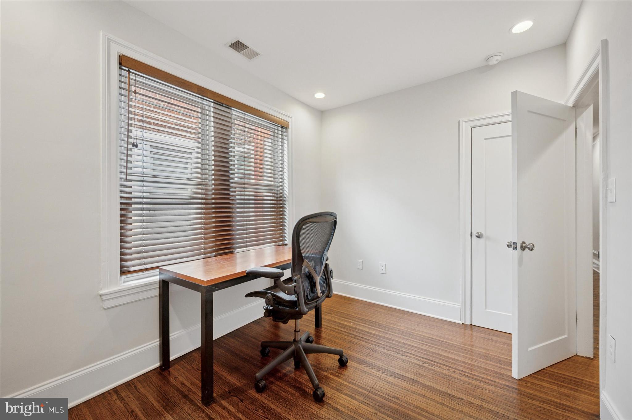4935 Pine Street Philadelphia, PA 19143 - Photo 30 of 40 a view of a workspace with furniture and a window