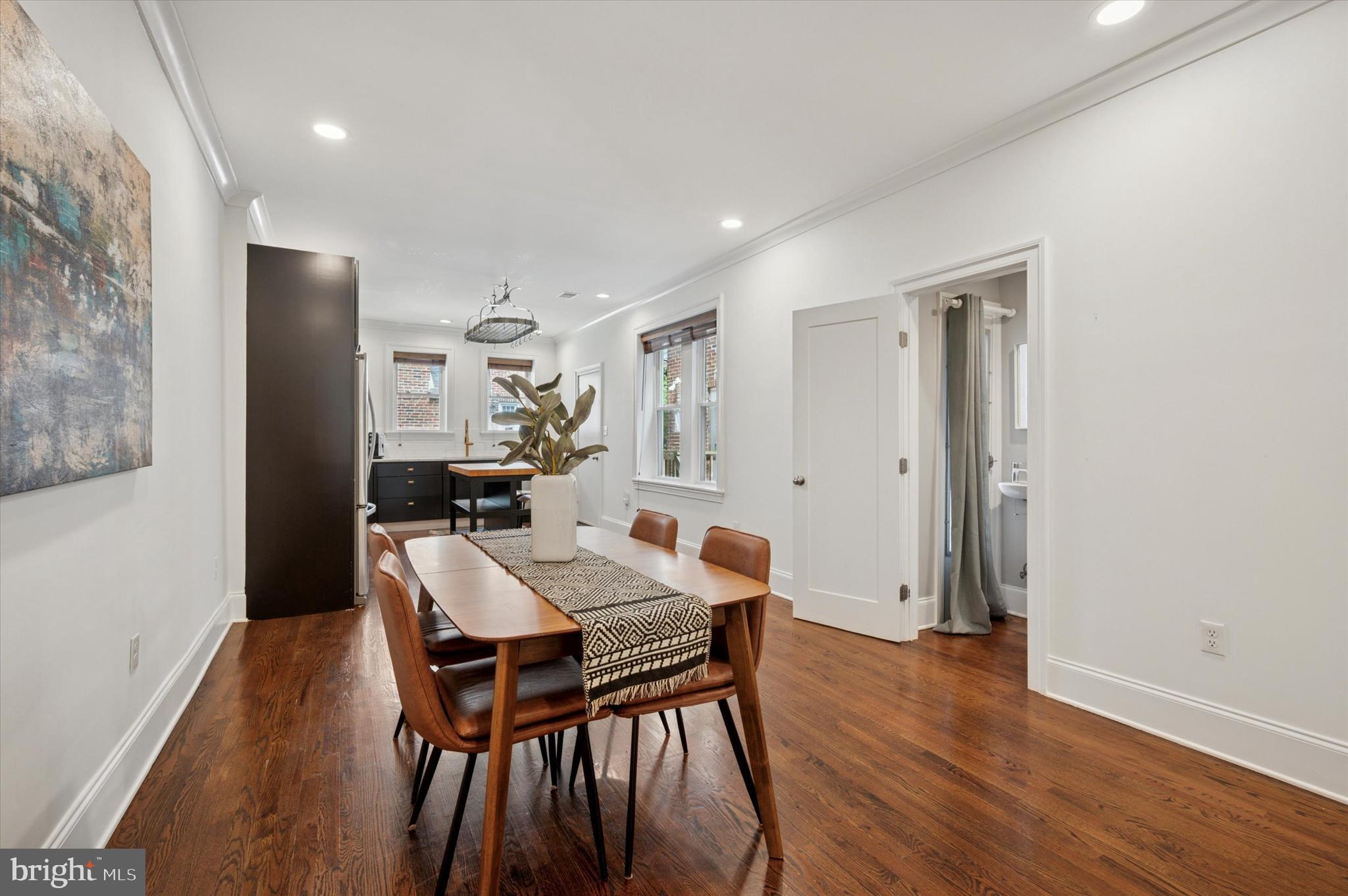 4935 Pine Street Philadelphia, PA 19143 - Photo 7 of 40 a view of a dining room with furniture and wooden floor