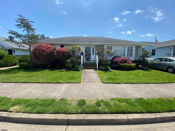 a view of a patio with a yard