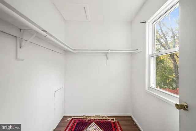 a view of walk in closet with window