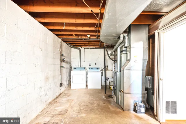 a backyard of a house with a large tree