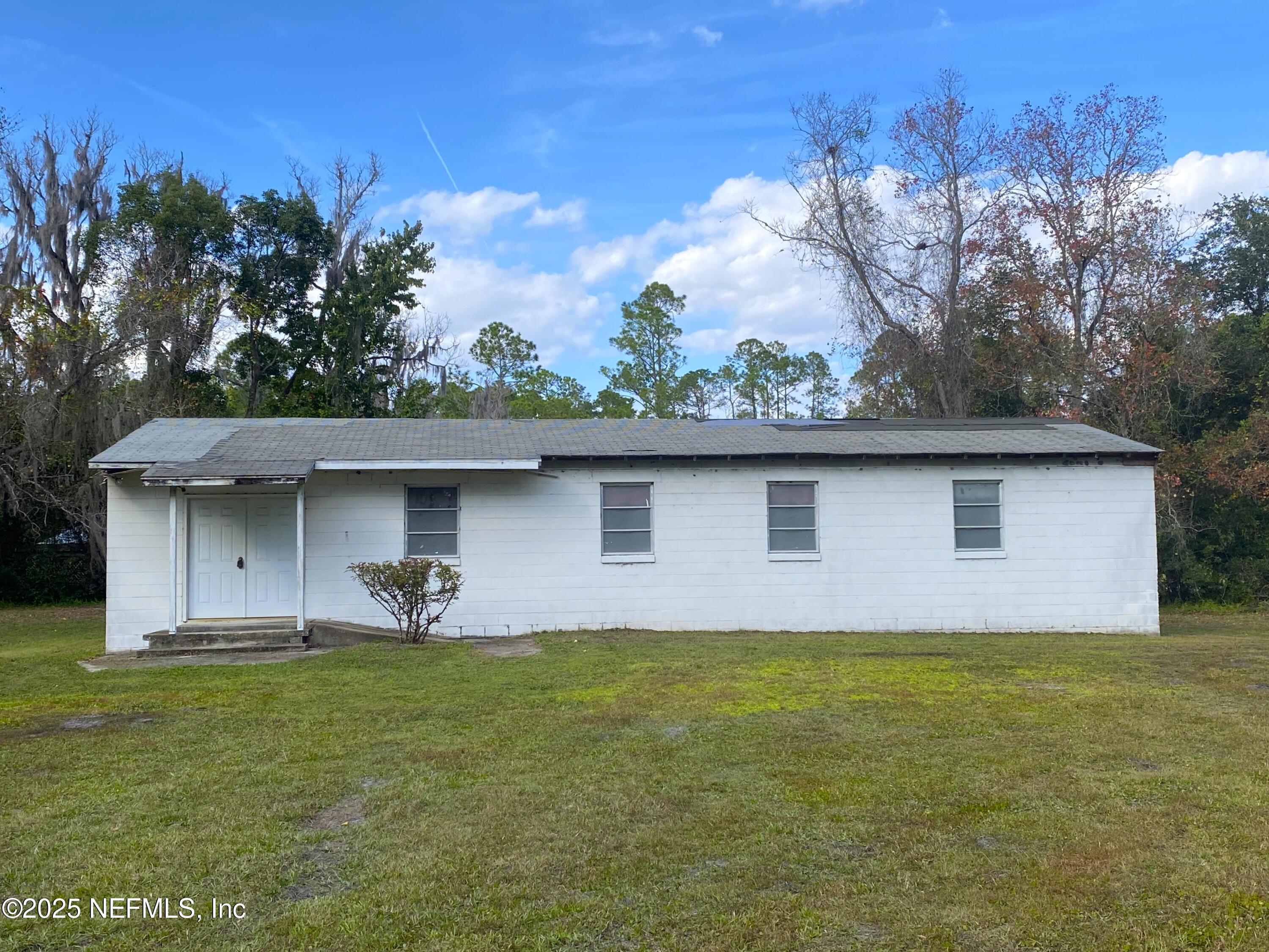 228 Yelvington Road East Palatka, FL 32131 - Photo 1 of 32 a front view of a house with garden