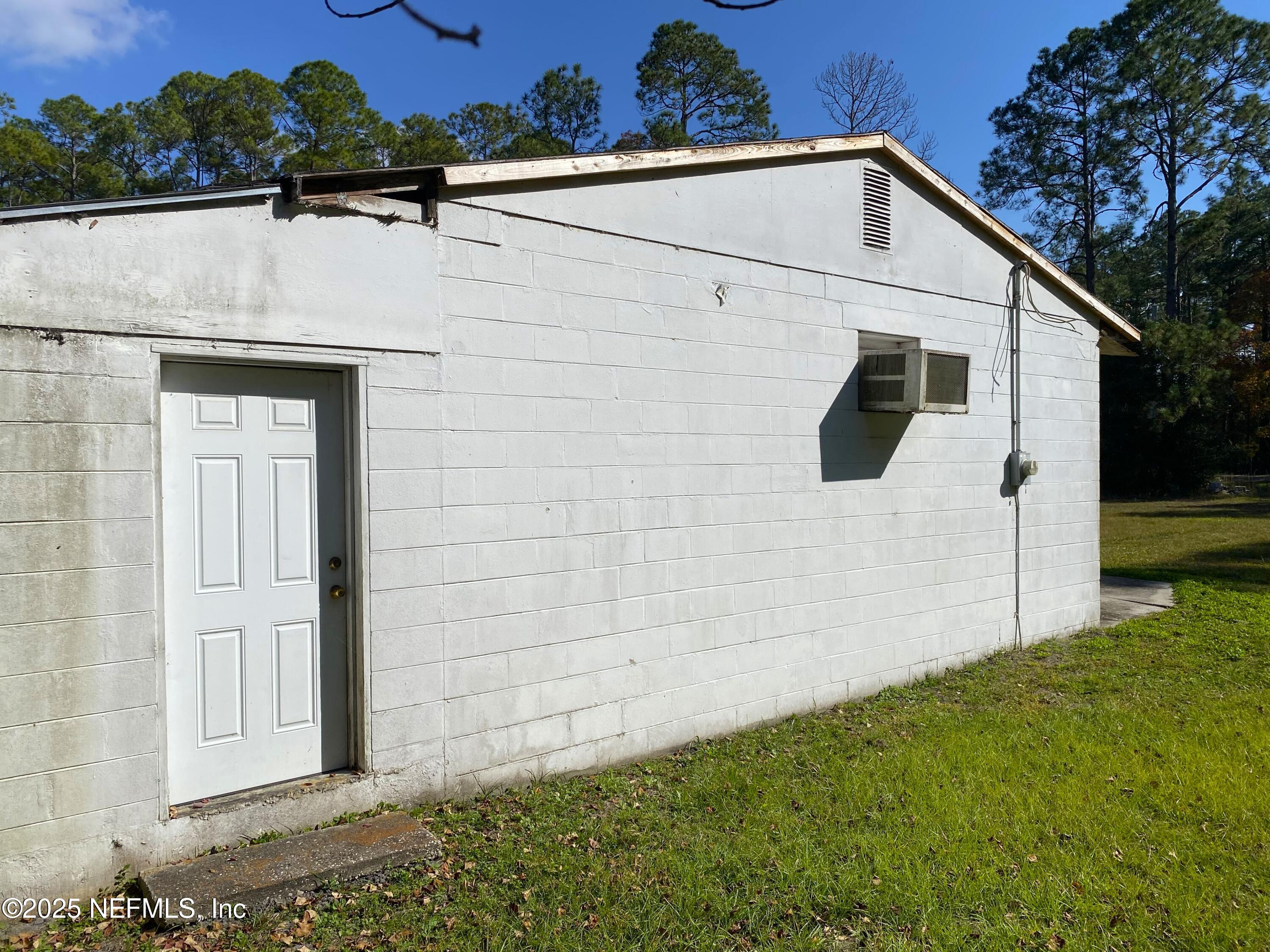 228 Yelvington Road East Palatka, FL 32131 - Photo 21 of 32 a view of a white house with a yard