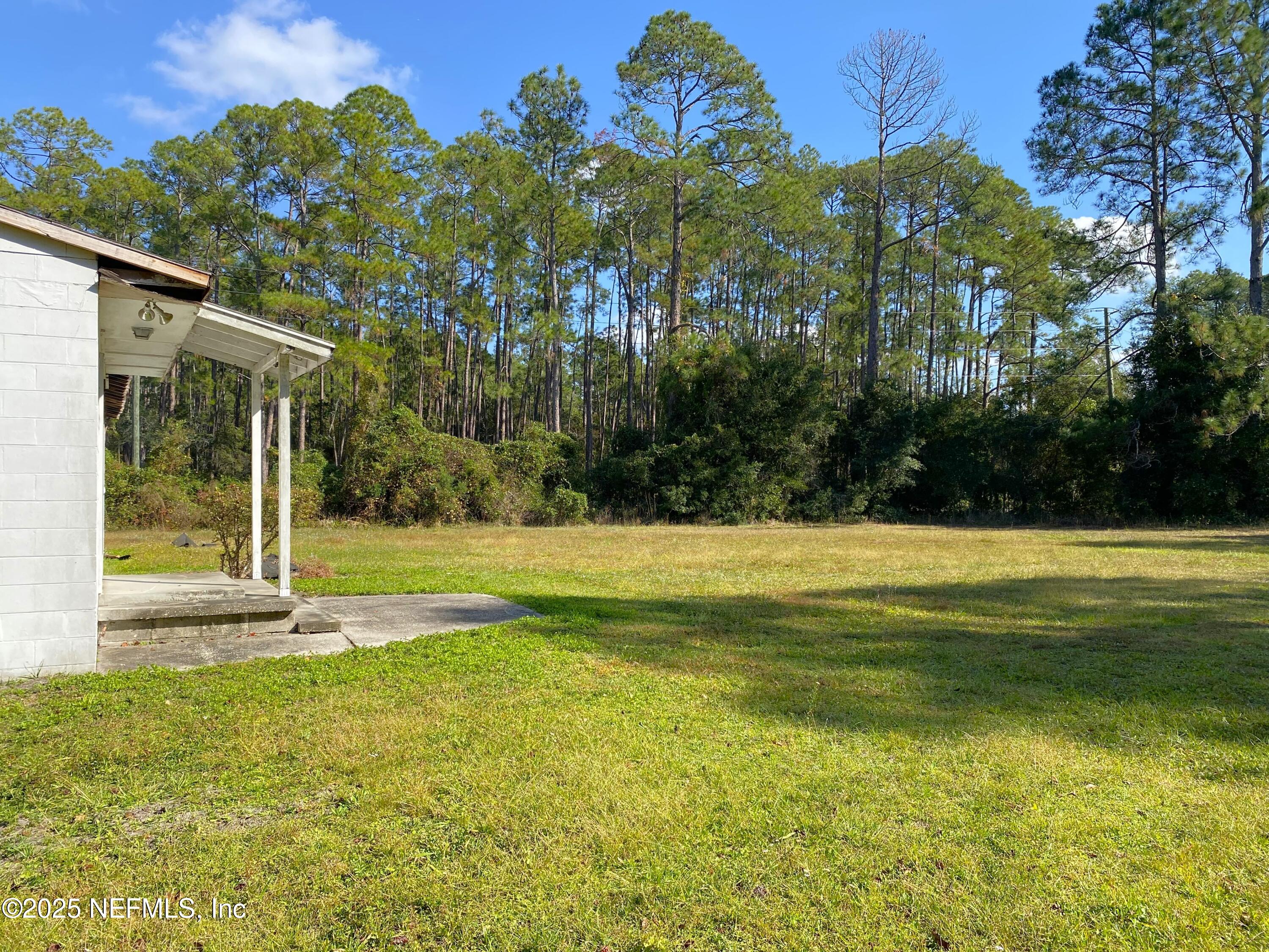 228 Yelvington Road East Palatka, FL 32131 - Photo 22 of 32 a view of swimming pool with an outdoor space and seating area