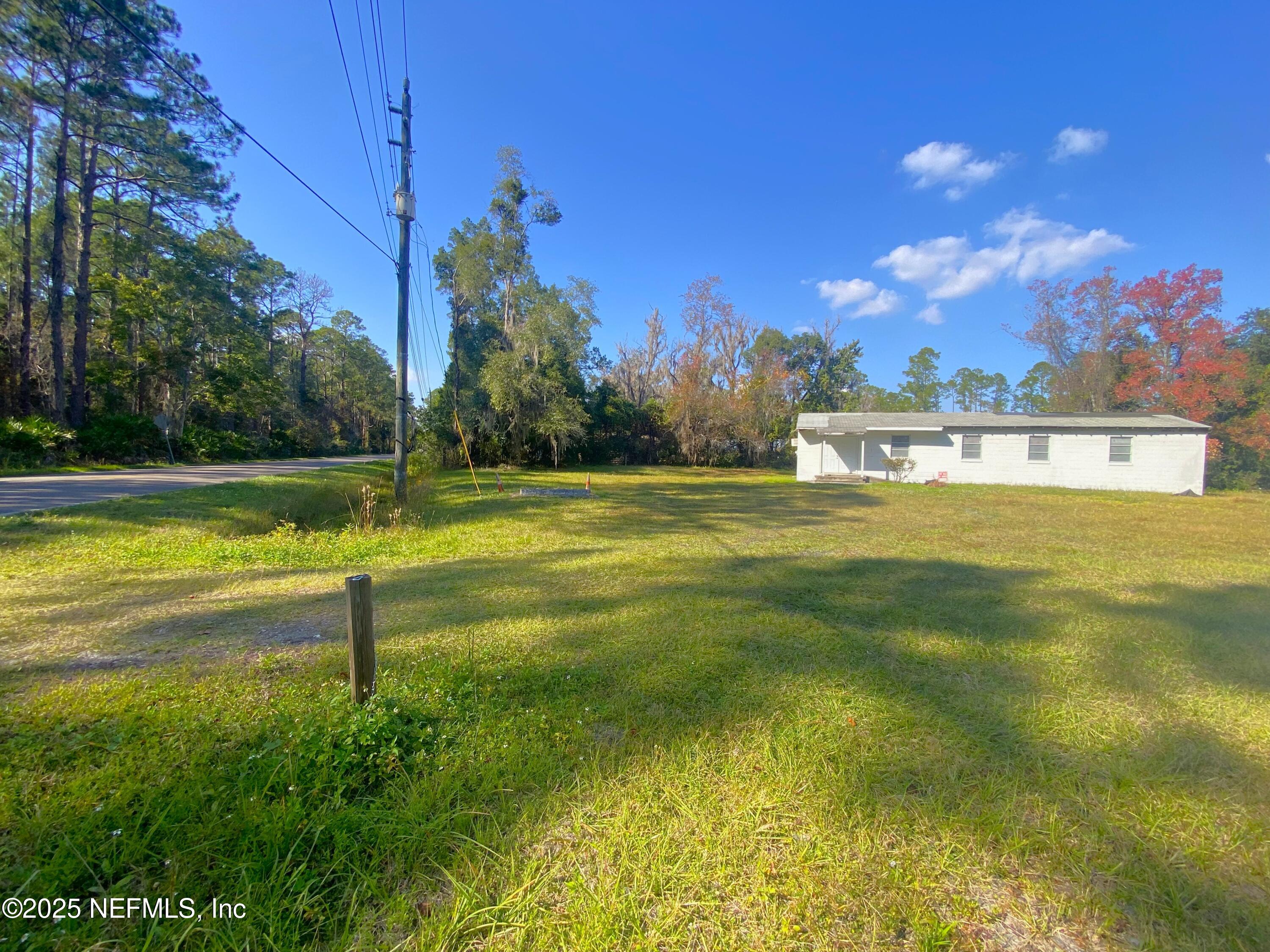 228 Yelvington Road East Palatka, FL 32131 - Photo 29 of 32 a view of a lake with a big yard
