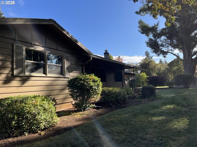6542 Liberty Road South Salem, OR 97306 - Photo 3 of 21 a front view of a house with a yard