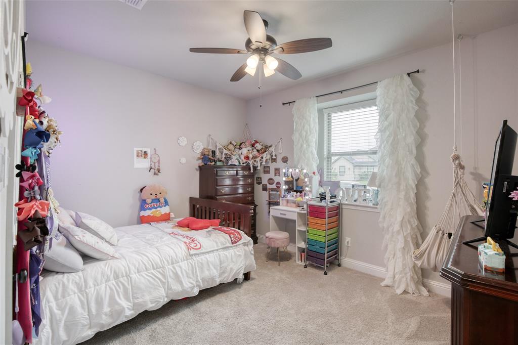 211 Rees Avenue Godley, TX 76044 - Photo 13 of 18 a bedroom with furniture and a bed