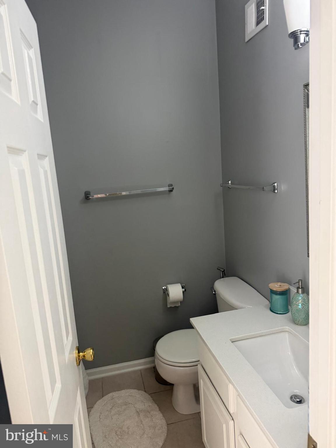 8469 Silverdale Road Lorton, VA 22079 - Photo 12 of 17 a white toilet sitting next to a white sink