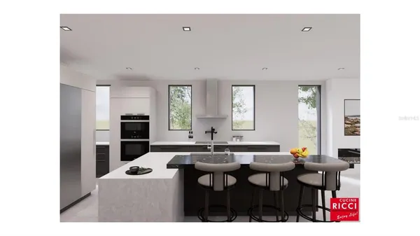 a kitchen with stainless steel appliances kitchen island granite countertop a sink and cabinets
