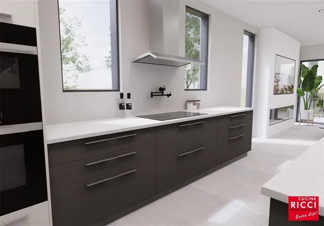 a kitchen with a sink and a mirror