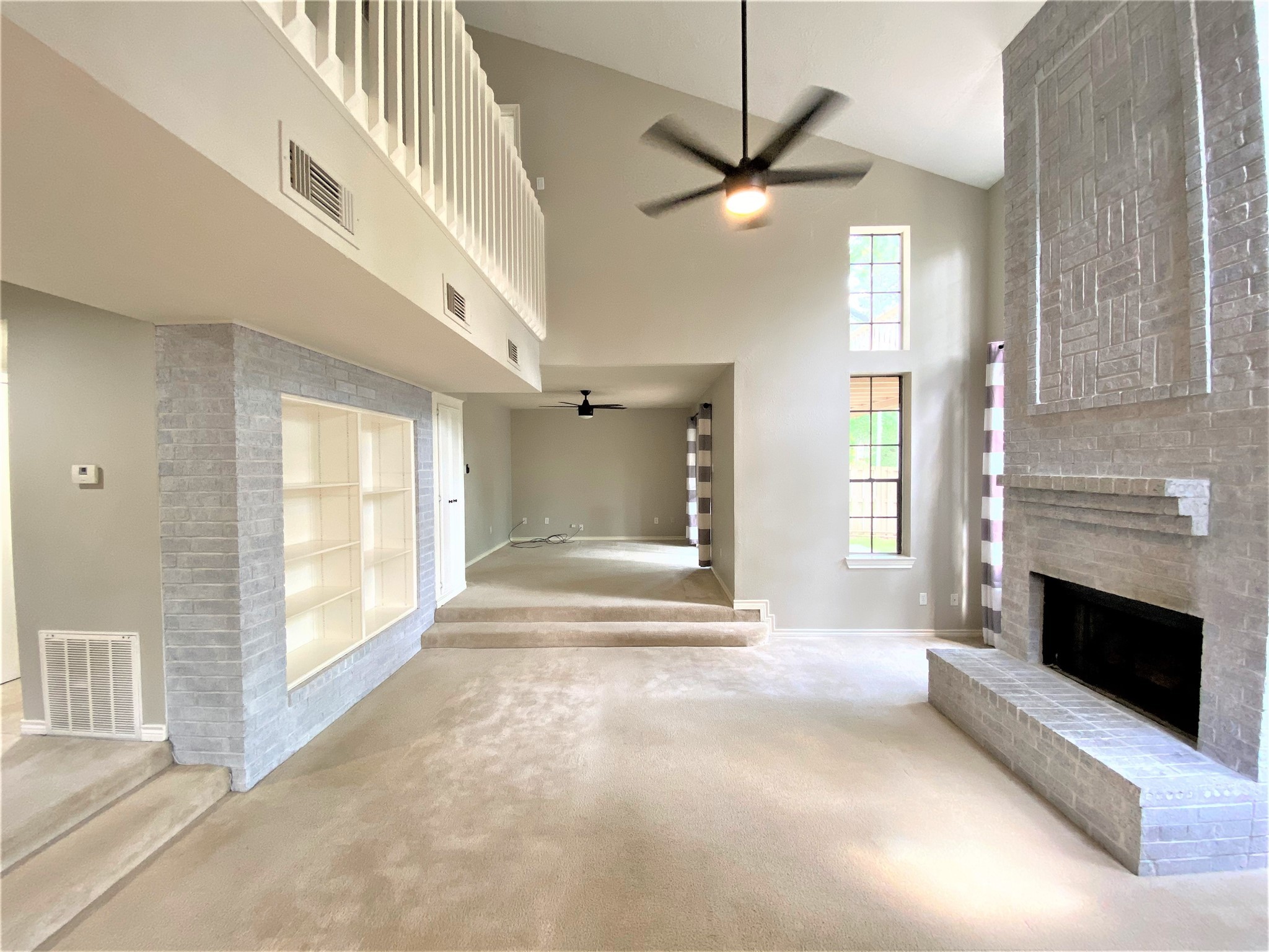 12303 Longfellow Drive Montgomery, TX 77356 - Photo 6 of 25 a view of an empty room with fireplace and a window