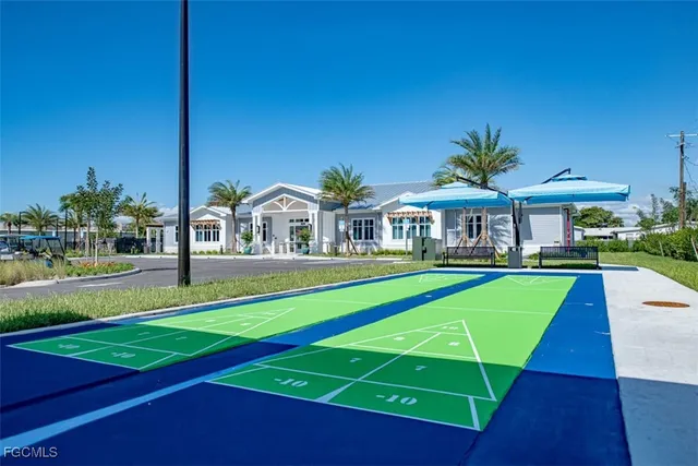 a view of an house with backyard and a swimming pool