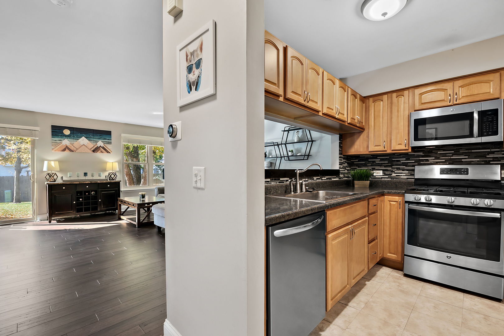 986 Ridgefield Lane Wheeling, IL 60090 - Photo 4 of 17 a kitchen with stainless steel appliances a stove top oven a sink and a refrigerator
