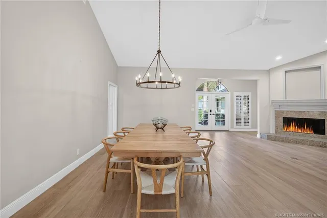 a kitchen with stainless steel appliances granite countertop a sink a stove and a refrigerator