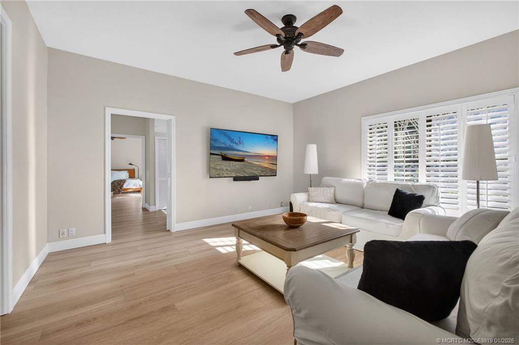3211 Southeast Court Drive Stuart, FL 34997 - Photo 24 of 60 a living room with furniture and a large window