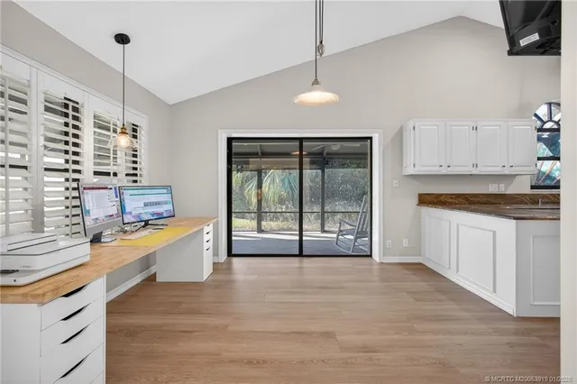 a bedroom with a bed and a ceiling fan