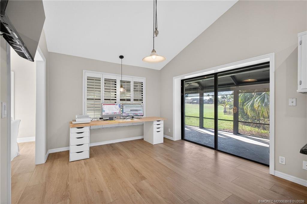 3211 Southeast Court Drive Stuart, FL 34997 - Photo 30 of 60 a large space with a large window and wooden floor