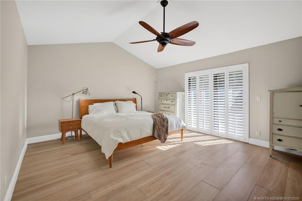 3211 Southeast Court Drive Stuart, FL 34997 - Photo 31 of 60 a bedroom with a bed and window
