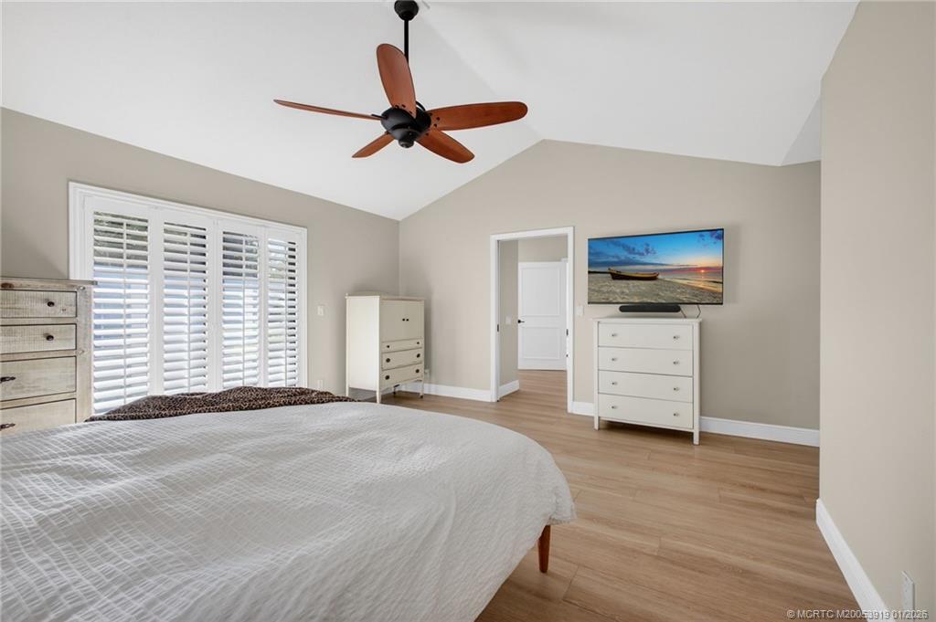 3211 Southeast Court Drive Stuart, FL 34997 - Photo 33 of 60 a bedroom with furniture and window