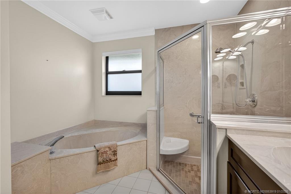 3211 Southeast Court Drive Stuart, FL 34997 - Photo 34 of 60 a bathroom with a granite countertop sink toilet and shower