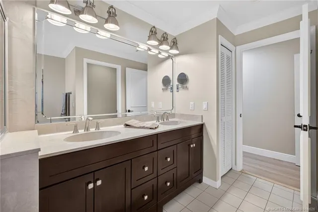a kitchen with a sink a stove and cabinets