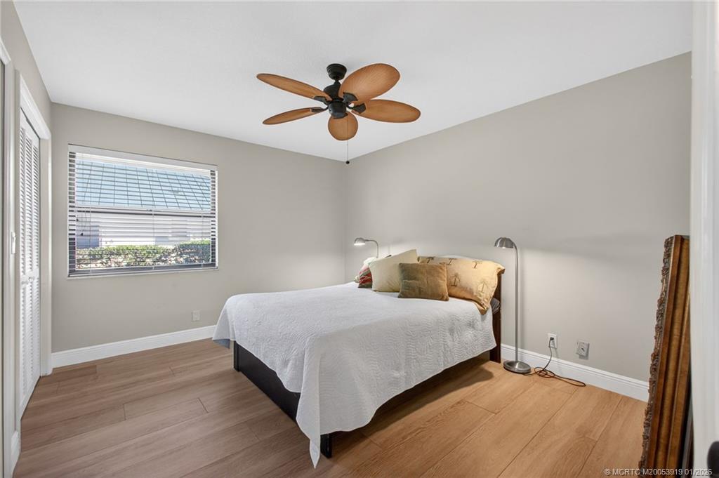 3211 Southeast Court Drive Stuart, FL 34997 - Photo 36 of 60 a bedroom with a bed and window