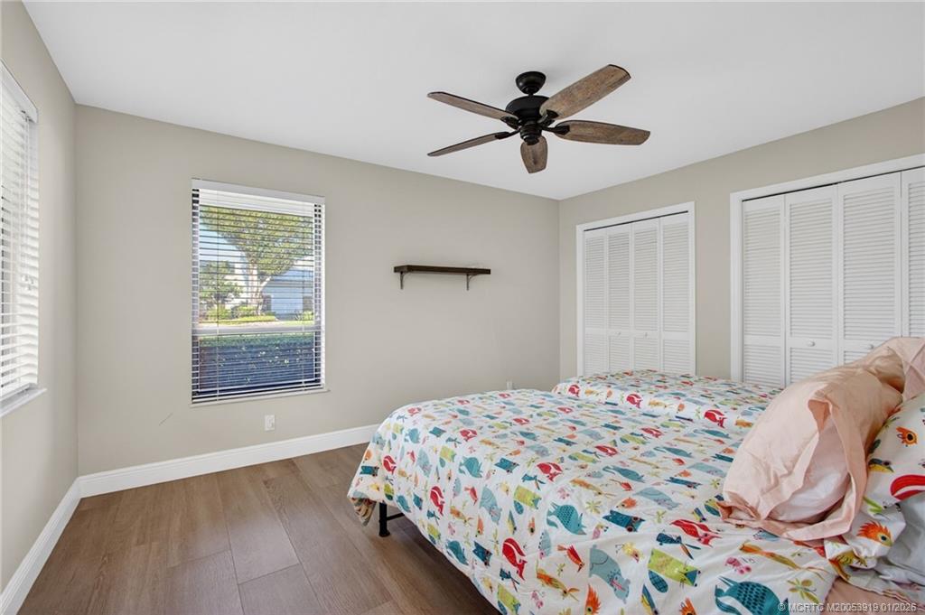 3211 Southeast Court Drive Stuart, FL 34997 - Photo 40 of 60 a bedroom that has a bed and a window