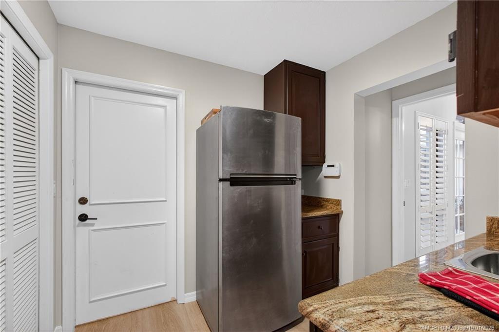 3211 Southeast Court Drive Stuart, FL 34997 - Photo 44 of 60 a refrigerator freezer sitting in a kitchen