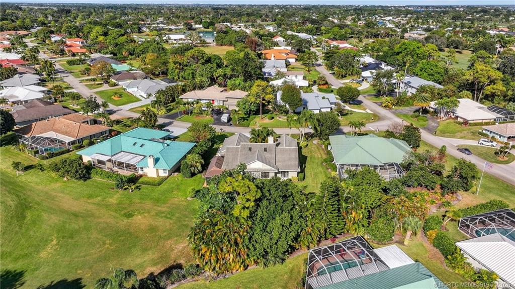 3211 Southeast Court Drive Stuart, FL 34997 - Photo 51 of 60 an aerial view of residential houses with outdoor space and trees