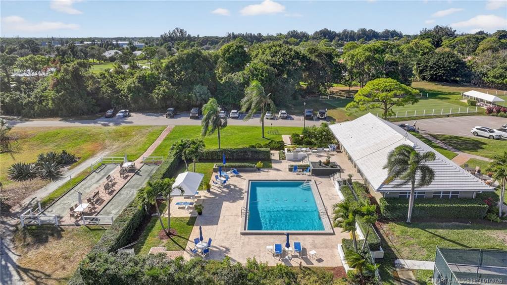 3211 Southeast Court Drive Stuart, FL 34997 - Photo 56 of 60 an aerial view of a house with a swimming pool patio and outdoor seating
