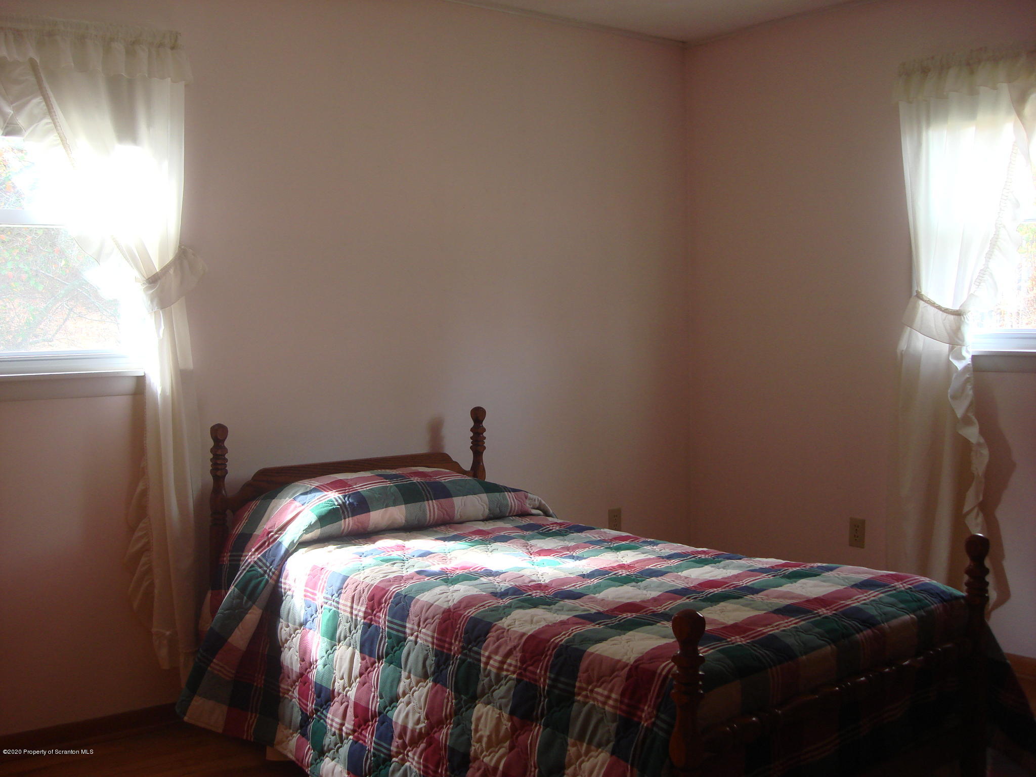 72 Hall Road Laceyville, PA 18623 - Photo 12 of 67 a bed sitting in a bedroom next to a window