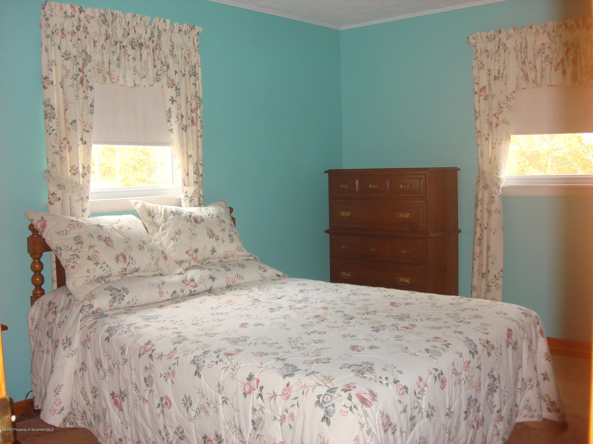 72 Hall Road Laceyville, PA 18623 - Photo 13 of 67 a large bed sitting in a bedroom next to a window