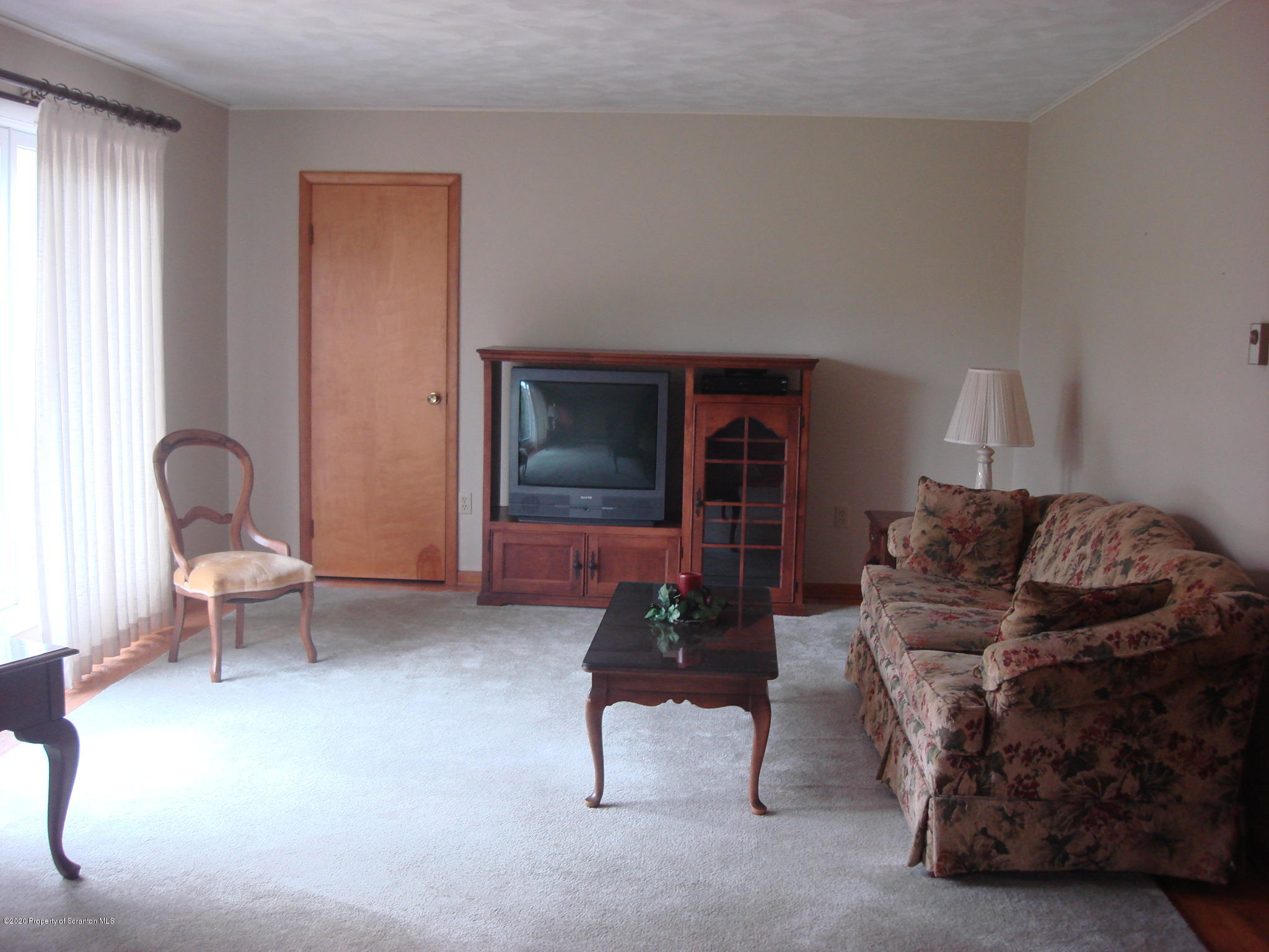 72 Hall Road Laceyville, PA 18623 - Photo 2 of 67 a living room with furniture and a fireplace