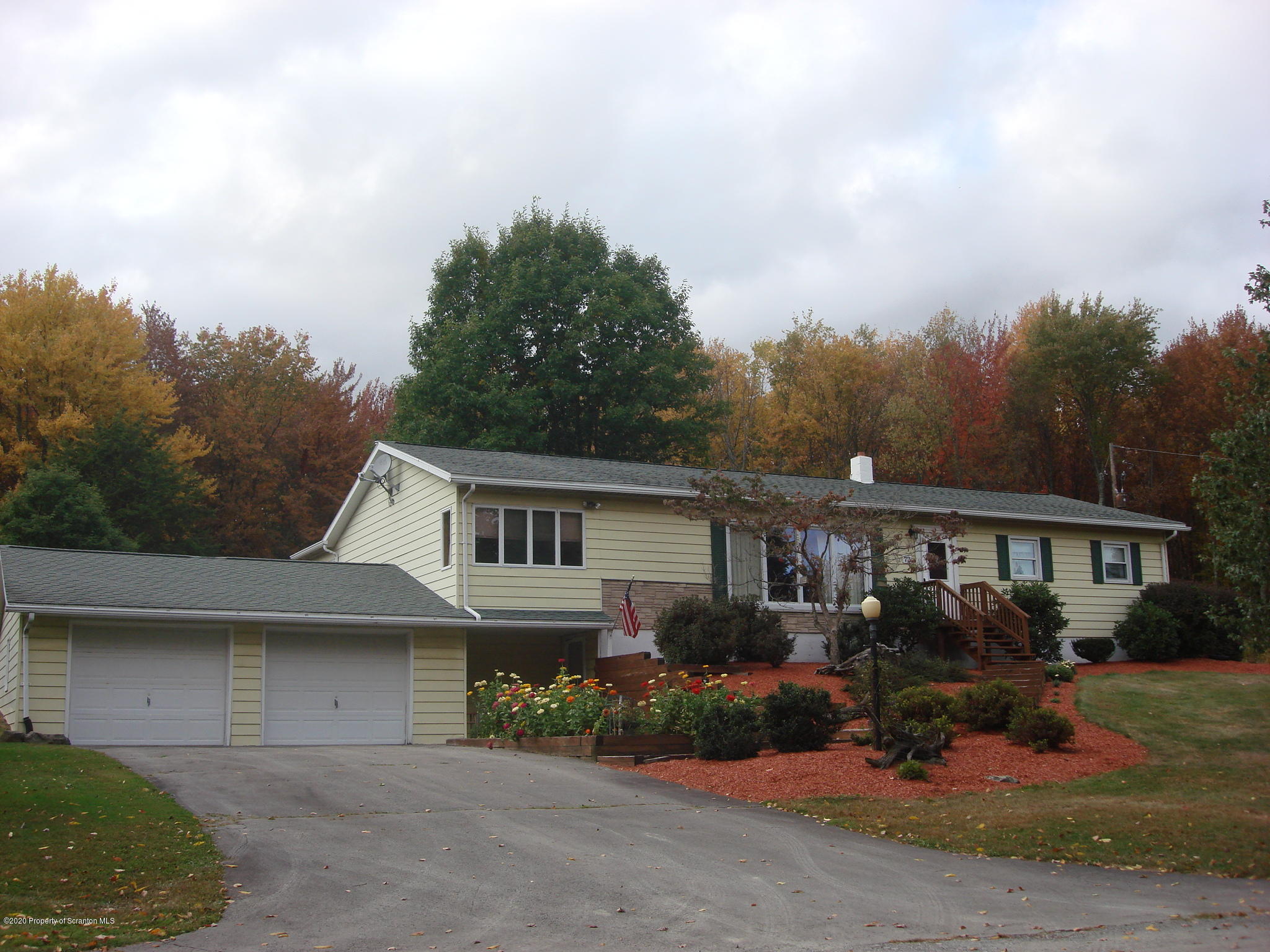 72 Hall Road Laceyville, PA 18623 - Photo 51 of 67 a front view of a house with garden