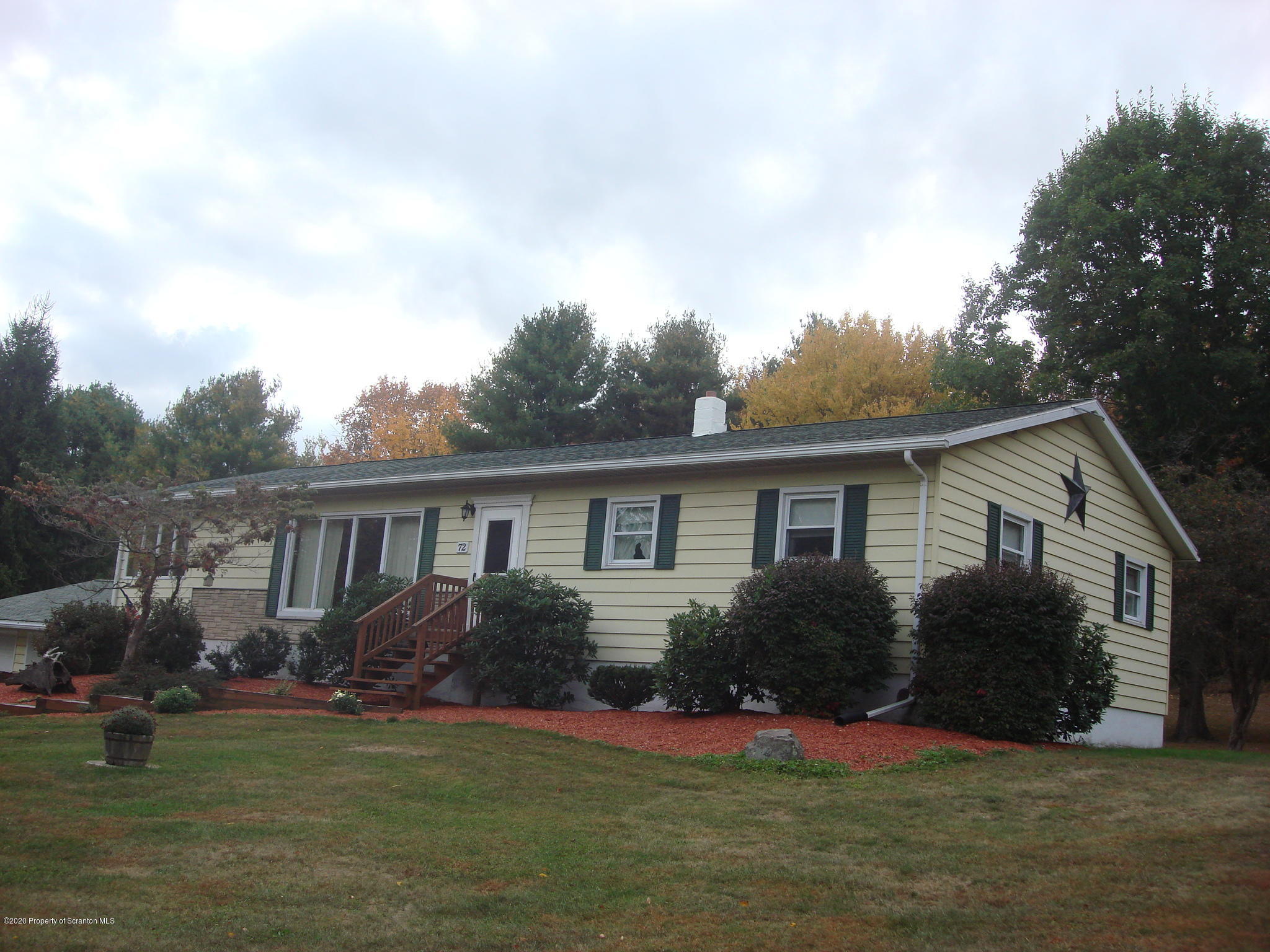 72 Hall Road Laceyville, PA 18623 - Photo 60 of 67 a view of a house with a big yard potted plants and large tree