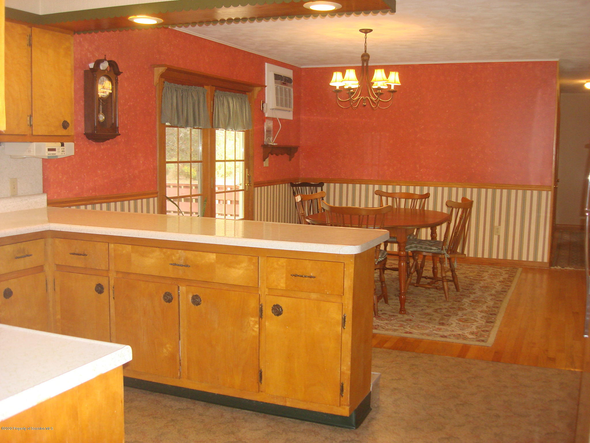 72 Hall Road Laceyville, PA 18623 - Photo 8 of 67 a dining table with a window and kitchen view