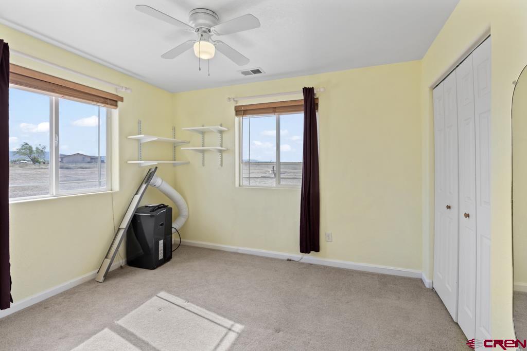19496 E Road Delta, CO 81416 - Photo 19 of 33 a view of a room with window and ceiling fan