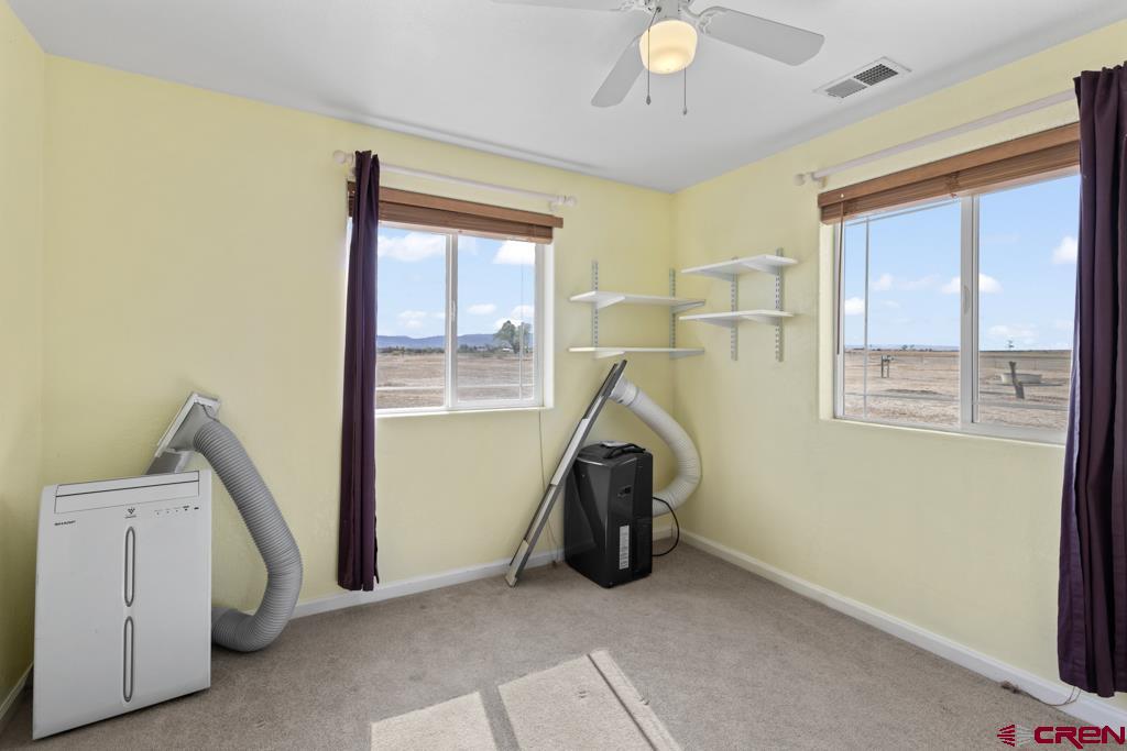 19496 E Road Delta, CO 81416 - Photo 20 of 33 a view of livingroom with furniture and windows