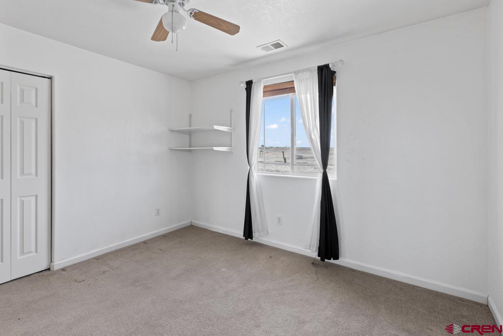 19496 E Road Delta, CO 81416 - Photo 22 of 33 an empty room with a bathroom