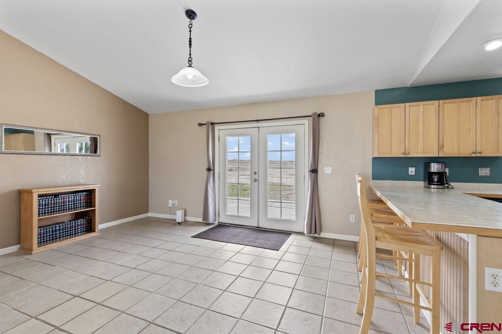 19496 E Road Delta, CO 81416 - Photo 9 of 33 a view of an empty room with a window and kitchen area