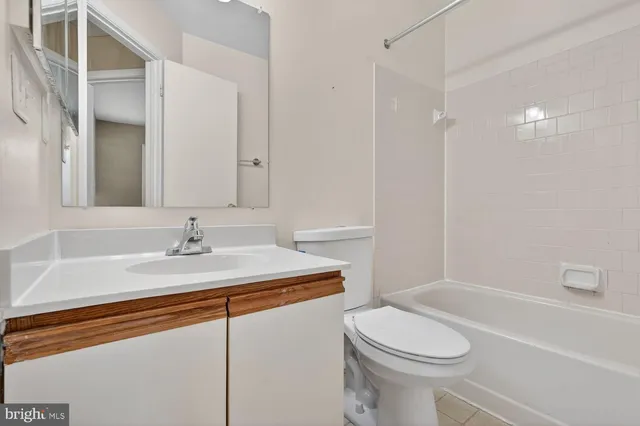 a bathroom with a sink a toilet and a bathtub