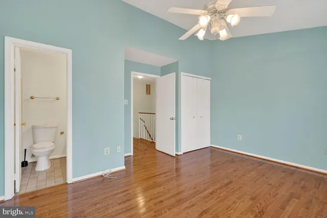 a view of an empty room and wooden floor