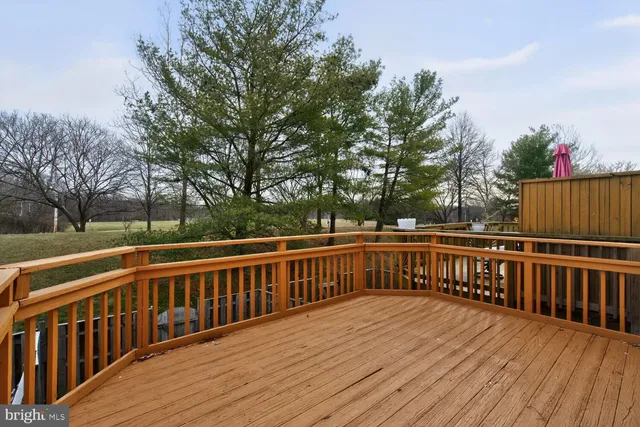 a view of deck with wooden floor and fence