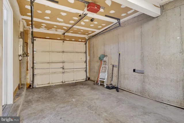 an empty room with a wooden door