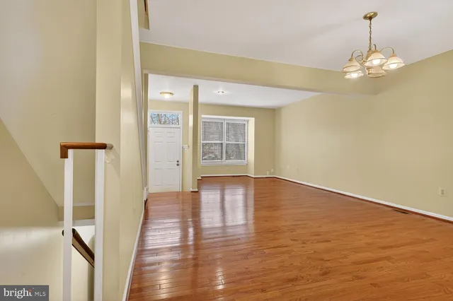 a view of livingroom with hardwood floor and hallway