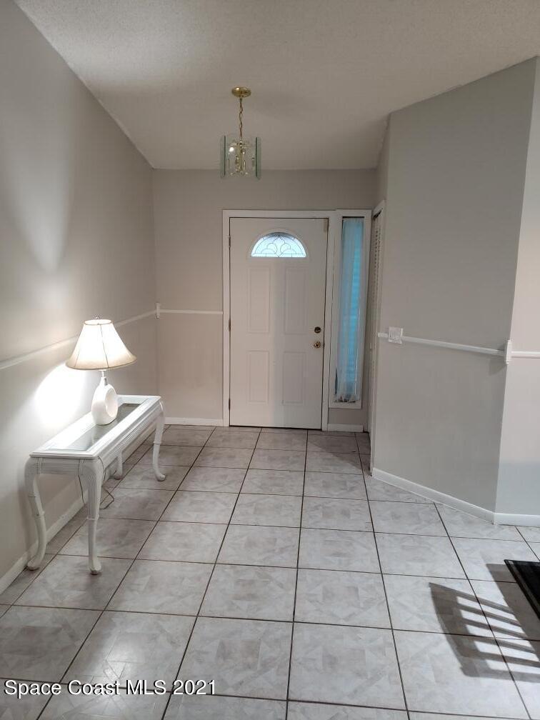 232 Rheine Road Northwest Palm Bay, FL 32907 - Photo 2 of 11 a view of an empty room and window