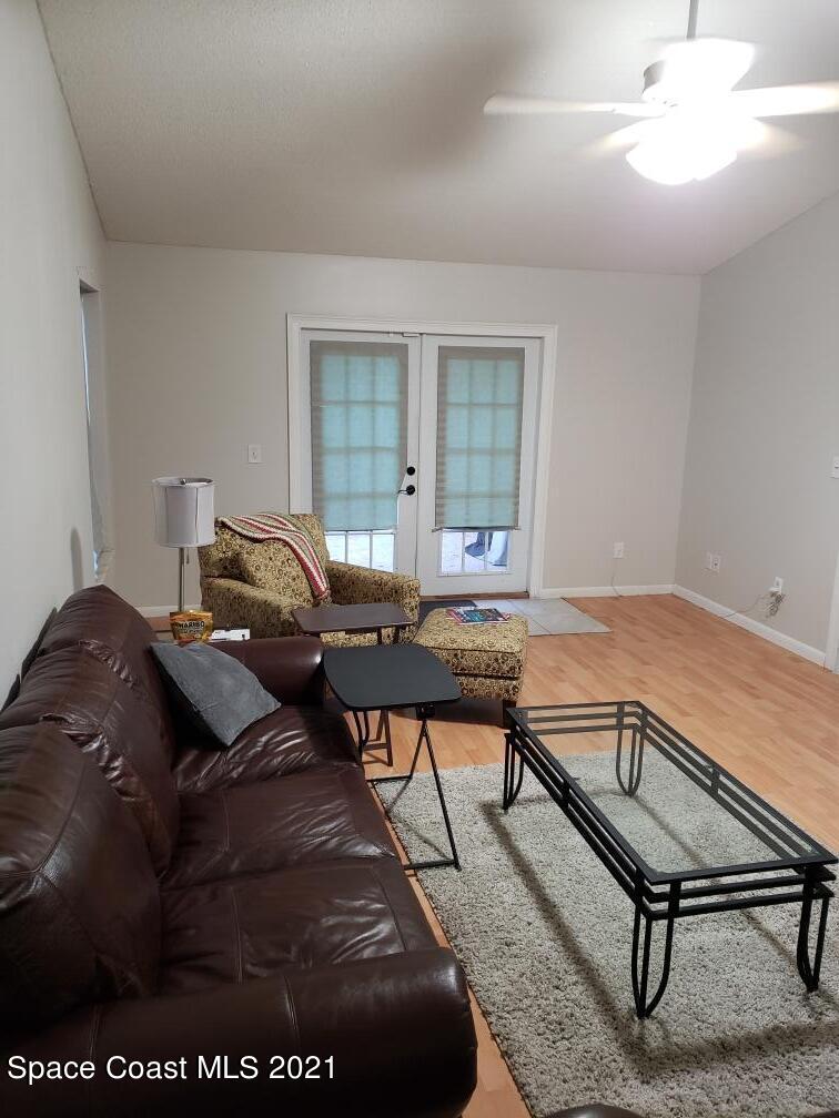 232 Rheine Road Northwest Palm Bay, FL 32907 - Photo 3 of 11 a living room with furniture