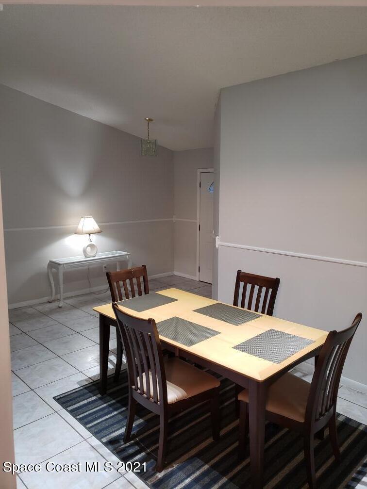 232 Rheine Road Northwest Palm Bay, FL 32907 - Photo 7 of 11 a view of a dining room with furniture