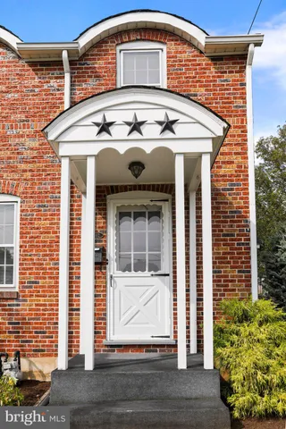 a front view of a house with a glass door